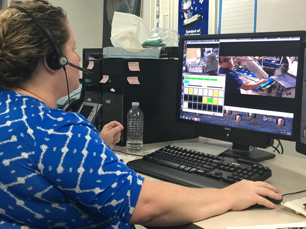 Nicole Dufour, flight integration lead, communicates directly with astronaut Joe Acaba during installation of NASA’s Advanced Plant Habitat in the Japanese Kibo module on the International Space Station. Dufour is in the Experiment Monitoring Room in the Space Station Processing Facility at Kennedy Space Center in Florida. The procedures to install the system took about six hours. 