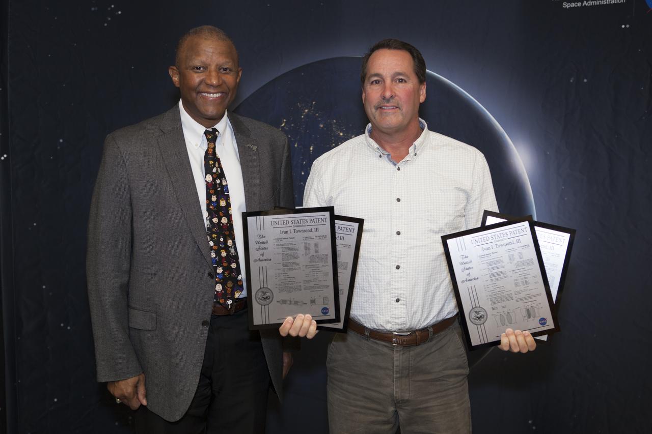 Ivan Townsend III displays the four U.S. Patent plaques he received during a ceremony at the 2017 Innovation Expo at NASA's Kennedy Space Center in Florida. The purpose of the annual two-day expo is to help foster innovation and creativity among the Kennedy workforce. The event included several keynote speakers, training opportunities, an innovation showcase and the KSC Kickstart competition. 