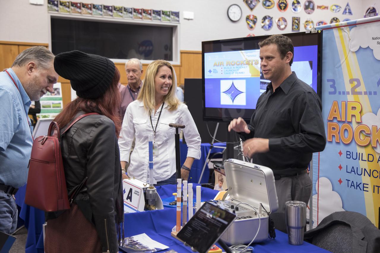 Shaun Daly, an integration engineer in the Launch Services Program, explains a new outreach activity for young students during the 2017 Innovation Expo showcase at NASA's Kennedy Space Center in Florida. The purpose of the annual two-day event is to help foster innovation and creativity among the Kennedy workforce. The event included several keynote speakers, training opportunities, an innovation showcase and the KSC Kickstart competition. 