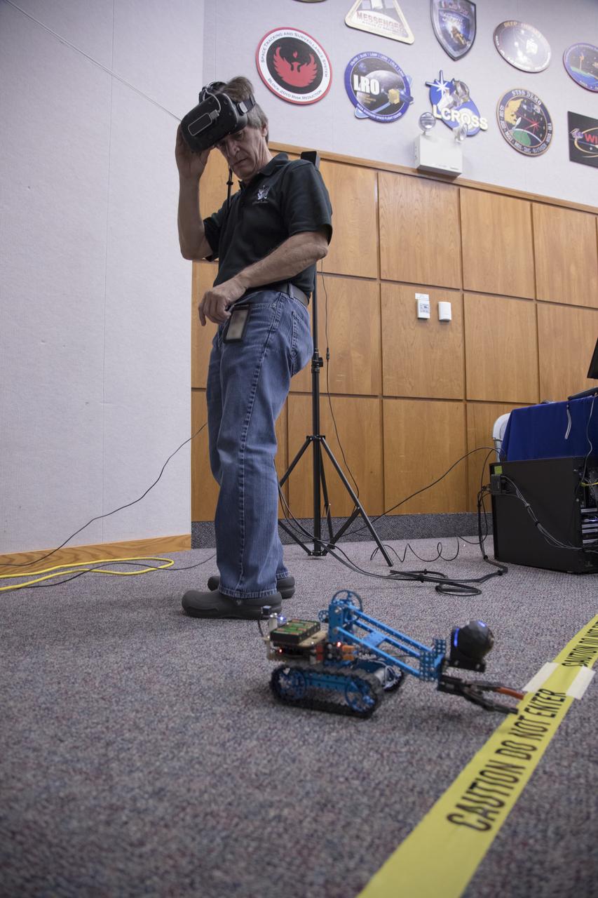 A worker tries out a virtual reality experience during the 2017 Innovation Expo at NASA's Kennedy Space Center in Florida. The purpose of the annual two-day event is to help foster innovation and creativity among the Kennedy workforce. The event included several keynote speakers, training opportunities, an innovation showcase and the KSC Kickstart competition. 