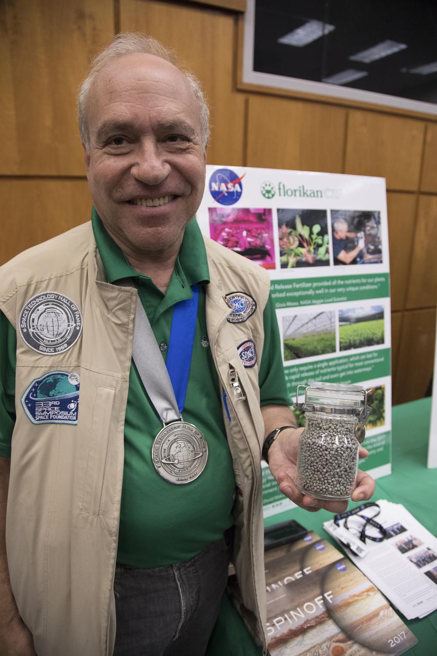 Ed Rosenthal, founder and chairman of Florikan controlled release fertilizers, displays his plant growth material during the 2017 Innovation Expo showcase at NASA's Kennedy Space Center in Florida. The controlled release fertilizer is used in NASA's Veggie plant growth system on the International Space Station and in the Veggie control unit in a laboratory in the Space Station Processing Facility. The purpose of the annual two-day event is to help foster innovation and creativity among the Kennedy workforce. The event included several keynote speakers, training opportunities, an innovation showcase and the KSC Kickstart competition. 
