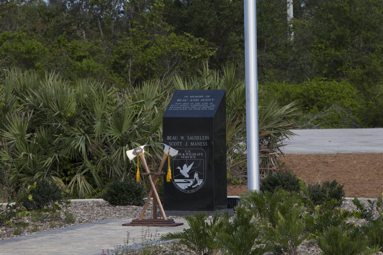 Ceremonial Pulaski tools are positioned in front of a new memorial marker Nov. 1 on the Merritt Island National Wildlife Refuge in Florida. During a joint ceremony, the Spaceport Integration Team and its partners were presented with the prestigious 2017 Pulaski Award and the new memorial marker was dedicated. The multi-agency team includes representatives from NASA's Kennedy Space Center, Cape Canaveral Air Force Station's 45th Space Wing, the Merritt Island National Wildlife Refuge, as well as the Florida Forest Service and Brevard County Fire Rescue. The memorial marker honors two fallen firefighters, Scott Maness and Beau Sauselein, who died fighting a wildfire on space center property in 1981. Held outdoors, the ceremony was attended by 140 guests.