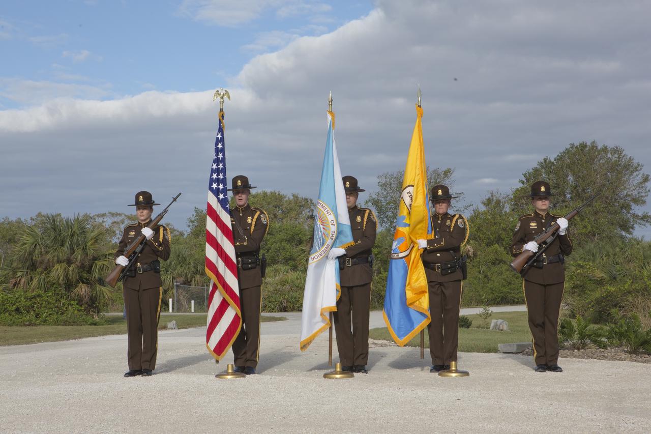 A presentation of colors by the U.S. Fish and Wildlife Service honor guard opened a ceremony Nov. 1 on the Merritt Island National Wildlife Refuge in Florida. During the joint ceremony, the Spaceport Integration Team and its partners were presented with the prestigious 2017 Pulaski Award and the new memorial marker was dedicated. The multi-agency team includes representatives from NASA's Kennedy Space Center, Cape Canaveral Air Force Station's 45th Space Wing, the Merritt Island National Wildlife Refuge, as well as the Florida Forest Service and Brevard County Fire Rescue. The memorial marker honors two fallen firefighters, Scott Maness and Beau Sauselein, who died fighting a wildfire on space center property in 1981. Held outdoors, the ceremony was attended by 140 guests.