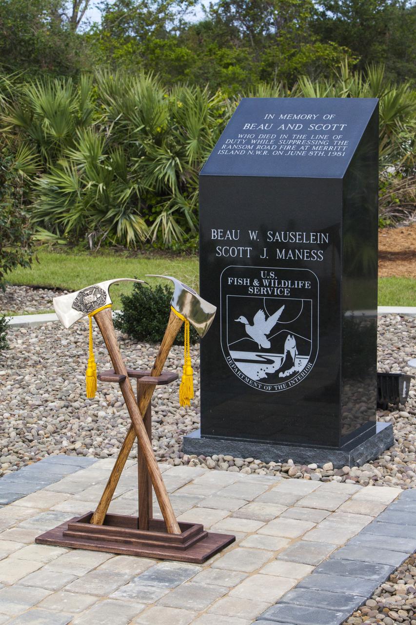 Ceremonial Pulaski tools are positioned in front of a new memorial marker Nov. 1 on the Merritt Island National Wildlife Refuge in Florida. During a joint ceremony, the Spaceport Integration Team and its partners were presented with the prestigious 2017 Pulaski Award and the new memorial marker was dedicated. The multi-agency team includes representatives from NASA's Kennedy Space Center, Cape Canaveral Air Force Station's 45th Space Wing, the Merritt Island National Wildlife Refuge, as well as the Florida Forest Service and Brevard County Fire Rescue. The memorial marker honors two fallen firefighters, Scott Maness and Beau Sauselein, who died fighting a wildfire on space center property in 1981. Held outdoors, the ceremony was attended by 140 guests.