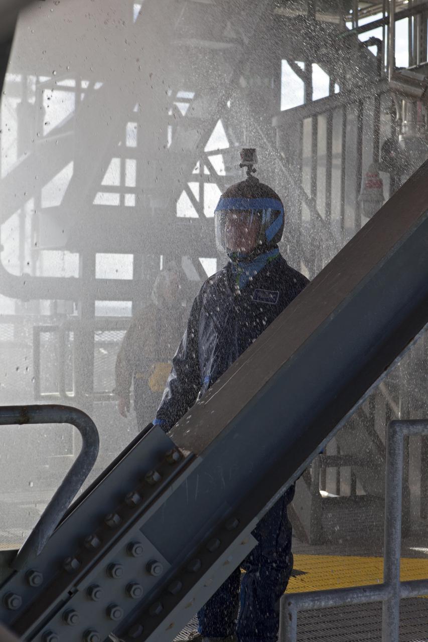 NASA and Boeing personnel experience conditions during a water deluge test on the Crew Access Tower at Space Launch Complex 41 on Cape Canaveral Air Force Station in Florida. The test gathered data on how launch site and astronaut crews would exit in the event of an emergency from the white room at the end of the crew access arm to the emergency escape system on the pad. Boeing’s Starliner will launch on a United Launch Alliance Atlas V rocket to the International Space Station as part of NASA’s Commercial Crew Program.