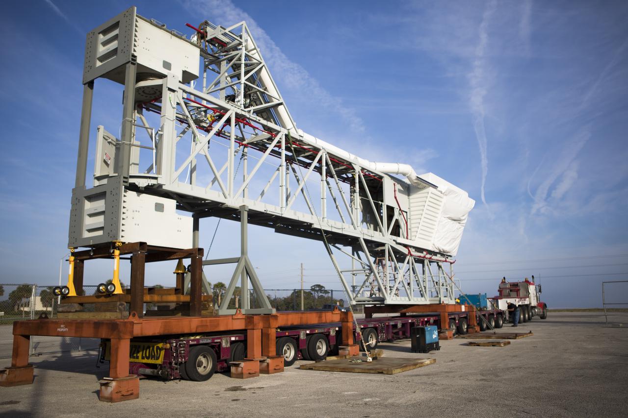 The Orion crew access arm, secured on a stand, is being prepared for its move from a storage location at NASA's Kennedy Space Center in Florida, to the mobile launcher (ML) tower near the Vehicle Assembly Building at the center. The crew access arm will be installed at about the 274-foot level on the tower. It will rotate from its retracted position and interface with the Orion crew hatch location to provide entry to the Orion crew module. The Ground Systems Development and Operations Program is overseeing installation of umbilicals and launch accessories on the ML tower. 
