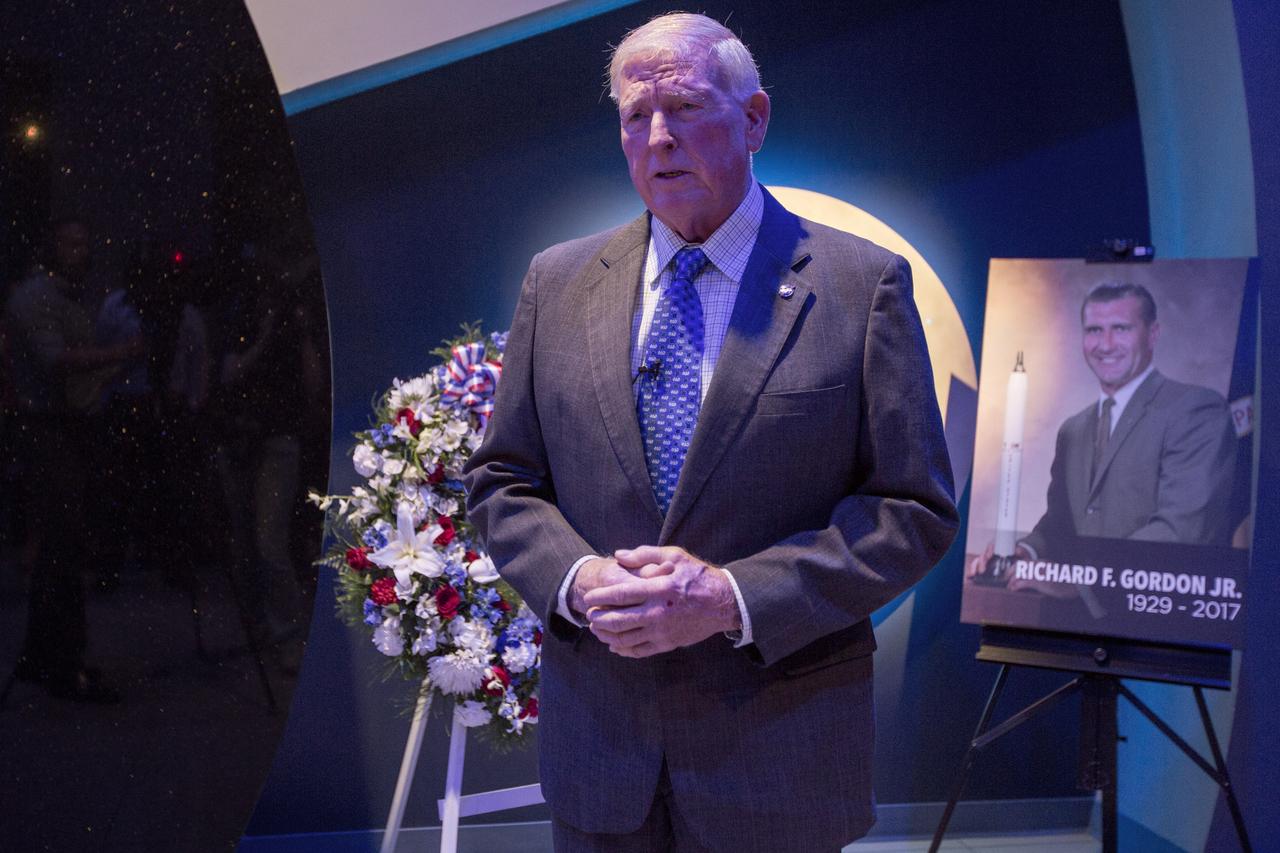 In the Heroes and Legends exhibit at the Kennedy Space Center Visitor Complex, space shuttle astronaut Jon McBride, speaks at a ceremony to honoring the memory of former NASA astronaut Richard Gordon. Having performed two spacewalks during Gemini XI in 1966, Gordon later served as command module pilot on Apollo 12 in 1969. Gordon died Nov. 6, 2017, at the age of 88.