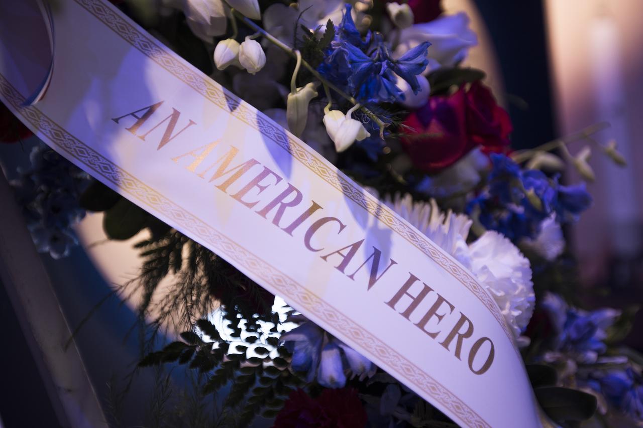In the Heroes and Legends exhibit at the Kennedy Space Center Visitor Complex, a memorial wreath was placed following a ceremony to honor the memory of former NASA astronaut Richard Gordon. He performed two spacewalks during Gemini XI in 1966 and was command module pilot on Apollo 12 in 1969. Gordon died Nov. 6, 2017, at the age of 88.