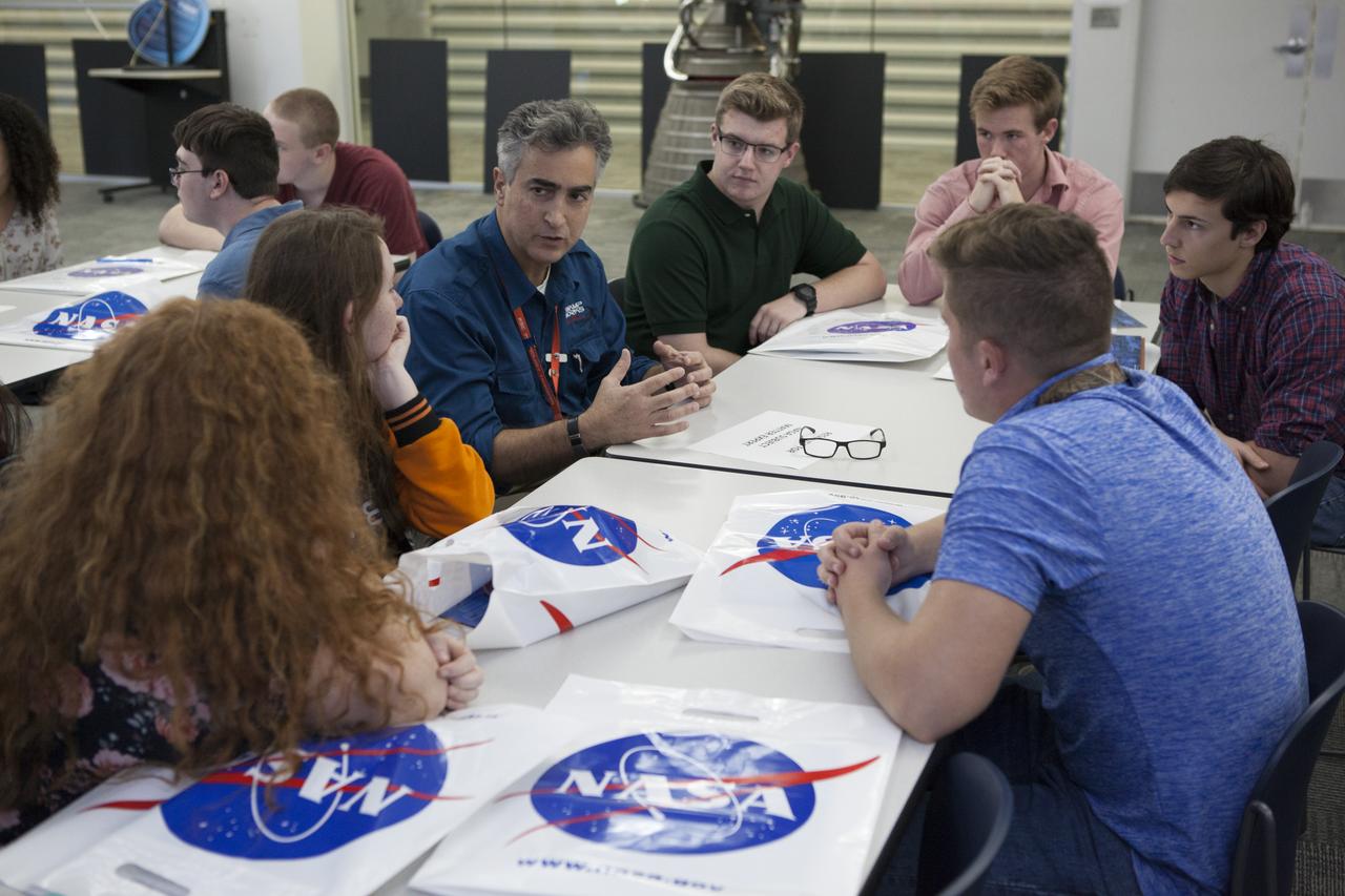 Jose Nunez, third from left, chief of the Flight Technologies Branch at NASA’s Kennedy Space Center in Florida, talks with students from Brevard County public high schools during a roundtable discussion at the Public Engagement Center at the Kennedy Space Center Visitor Complex. Top scholars from the high schools were invited to Kennedy Space Center for a tour of facilities, lunch and a roundtable discussion with engineers and scientists at the center. The 2017-2018 Brevard Top Scholars event was hosted by the center's Education Projects and Youth Engagement office to honor the top three scholars of the graduating student class from each of Brevard County’s public high schools. The students received a personalized certificate at the end of the day. 