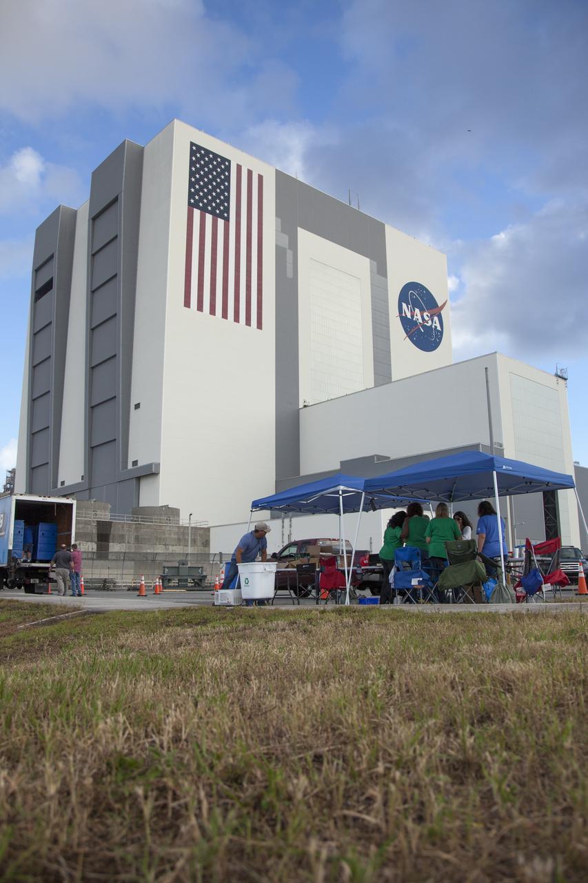 In the parking lot of the Vehicle Assembly Building at NASA's Kennedy Space Center in Florida, employees drop off used household items as part of America Recycles Day. The center recently partnered with Goodwill Industries and several other local organizations to collect items for reprocessing. The annual event is a program of Keep America Beautiful, dedicated to promoting and celebrating recycling.