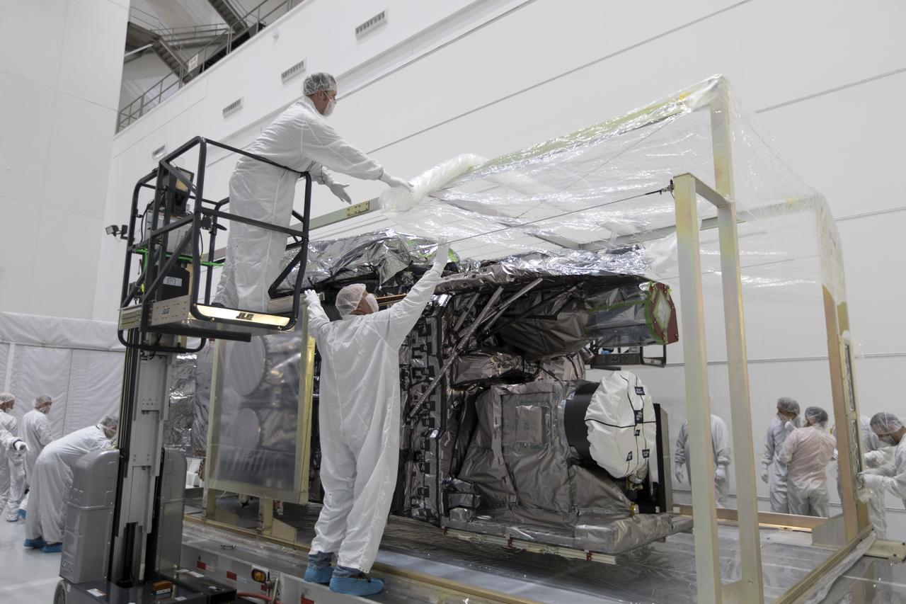 At Astrotech Space Operations in Titusville, Florida, technician and engineers inspect NOAA's Geostationary Operational Environmental Satellite-S (GOES-S) after it was uncrated from its shipping container. The facility is located near NASA's Kennedy Space Center. GOES-S is the second in a series of four advanced geostationary weather satellites. The GOES-R series - consisting of the GOES-R, GOES-S, GOES-T and GOES-U spacecraft - will significantly improve the detection and observation of environmental phenomena that directly affect public safety, protection of property and the nation's economic health and prosperity. GOES-S is slated to launch March 1, 2018 aboard a United Launch Alliance Atlas V rocket from Cape Canaveral Air Force Station in Florida. 