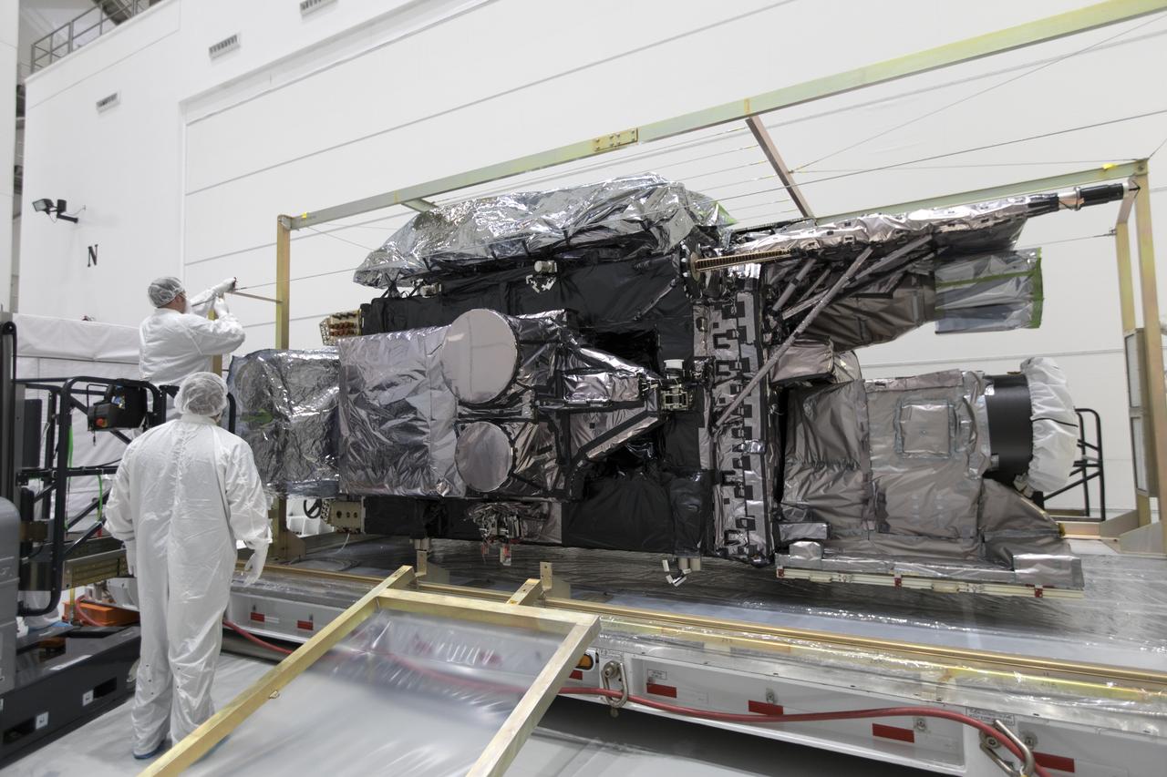 At Astrotech Space Operations in Titusville, Florida, a technician inspects NOAA's Geostationary Operational Environmental Satellite-S (GOES-S) after it was uncrated from its shipping container. The facility is located near NASA's Kennedy Space Center. GOES-S is the second in a series of four advanced geostationary weather satellites. The GOES-R series - consisting of the GOES-R, GOES-S, GOES-T and GOES-U spacecraft - will significantly improve the detection and observation of environmental phenomena that directly affect public safety, protection of property and the nation's economic health and prosperity. GOES-S is slated to launch March 1, 2018 aboard a United Launch Alliance Atlas V rocket from Cape Canaveral Air Force Station in Florida. 