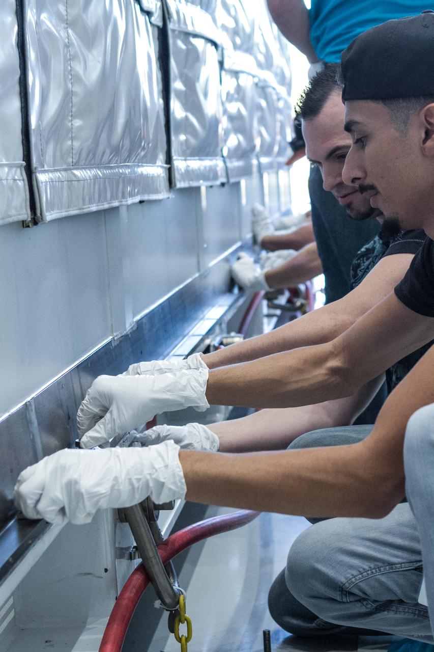 At Astrotech Space Operations in Titusville, Florida, technicians and engineers prepare to remove NOAA's Geostationary Operation Environmental Satellite-S (GOES-S) from its shipping container. GOES-S is the second in a series of four advanced geostationary weather satellites. The GOES-R series - consisting of the GOES-R, GOES-S, GOES-T and GOES-U spacecraft - will significantly improve the detection and observation of environmental phenomena that directly affect public safety, protection of property and the nation's economic health and prosperity. GOES-S is slated to launch March 1, 2018 aboard a United Launch Alliance Atlas V rocket from Cape Canaveral Air Force Station in Florida.