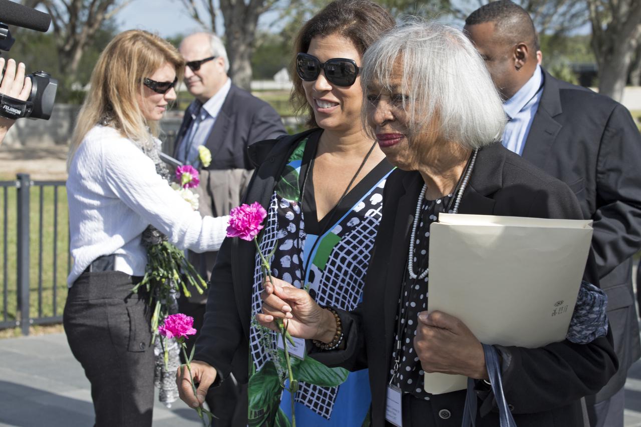 During an Astronauts Memorial Foundation tribute honoring U.S. Air Foce Maj. Robert Lawrence, his sister, Barbara Lawrence, Ph.D., places a flower at the Space Mirror Memorial which honors those lost in efforts to explore space. Selected in 1967 for the Manned Orbiting Laboratory Program, Lawrence was the first African-American astronaut. He lost his life in a training accident 50 years ago. The ceremony took place in the Center for Space Education at the Kennedy visitor complex.