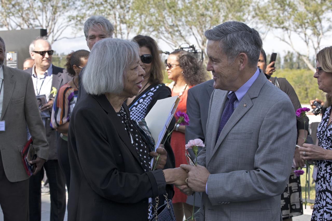Following an Astronauts Memorial Foundation tribute honoring U.S. Air Foce Maj. Robert Lawrence, Kennedy Space Center Director Bob Cabana, right, speaks with Lawrence's sister, Barbara Lawrence, Ph.D. Selected in 1967 for the Manned Orbiting Laboratory Program, Lawrence was the first African-American astronaut. He lost his life in a training accident 50 years ago. The ceremony took place in the Center for Space Education at the Kennedy Space Center Visitor Complex.