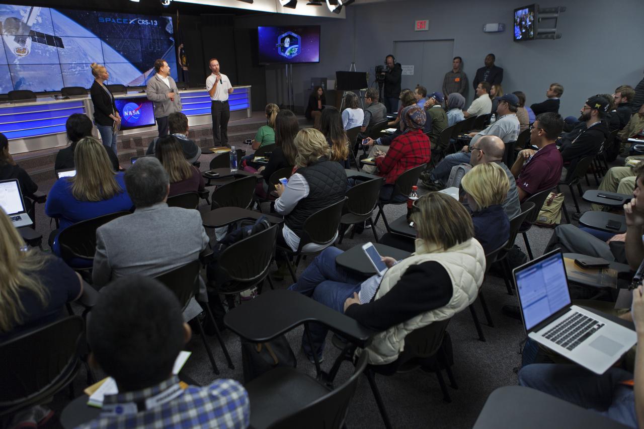 Cheryl Warner of NASA Communications, left, Kirt Costello, deputy chief scientist for the International Space Station Program at NASA’s Johnson Space Center in Houston, center, and Patrick O'Neill, Marketing and Communications manager at the Center of Advancement of Science in Space (CASIS), speak to members of social media in the Kennedy Space Center’s Press Site auditorium. The briefing focused on research planned for launch to the International Space Station. The scientific materials and supplies will be aboard a Dragon spacecraft scheduled for liftoff from Cape Canaveral Air Force Station's Space Launch Complex 40 at 11:46 a.m. EST, on Dec. 12, 2017. The SpaceX Falcon 9 rocket will launch the company's 13th Commercial Resupply Services mission to the space station.