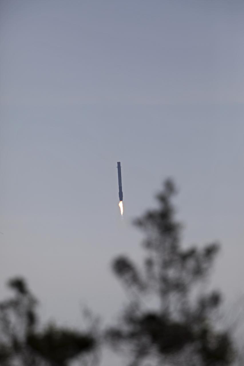 After boosting a Dragon spacecraft on its way to the International Space Staton for the SpaceX CRS-13 mission, the Falcon 9 first stage returns to Landin Zone 1 at Cape Canaveral Air Force Station. The rocket lifted off moments earlier from Space Launch Complex 40 at the Cape on the company's 13th commercial resupply services mission to the space station. Dragon will deliver additional supplies and research experiments that improve life on Earth and drive progress toward future space exploration.