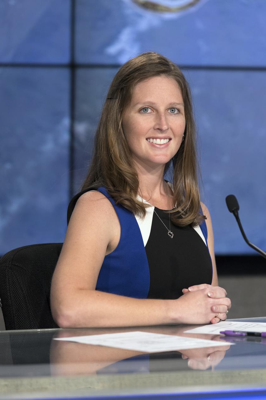 In the Press Site auditorium of NASA's Kennedy Space Center in Florida, from left, Stephanie Martin of NASA Communications, speaks to media at a post-launch news conference following the liftoff of SpaceX CRS-13. The flight is a commercial resupply services mission to the International Space Station. SpaceX CRS-13 lifted off atop a Falcon 9 rocket from Space Launch Complex 40 at Cape Canaveral Air Force Station at 10:36 a.m. EST with supplies and equipment and new science experiments for technology research.