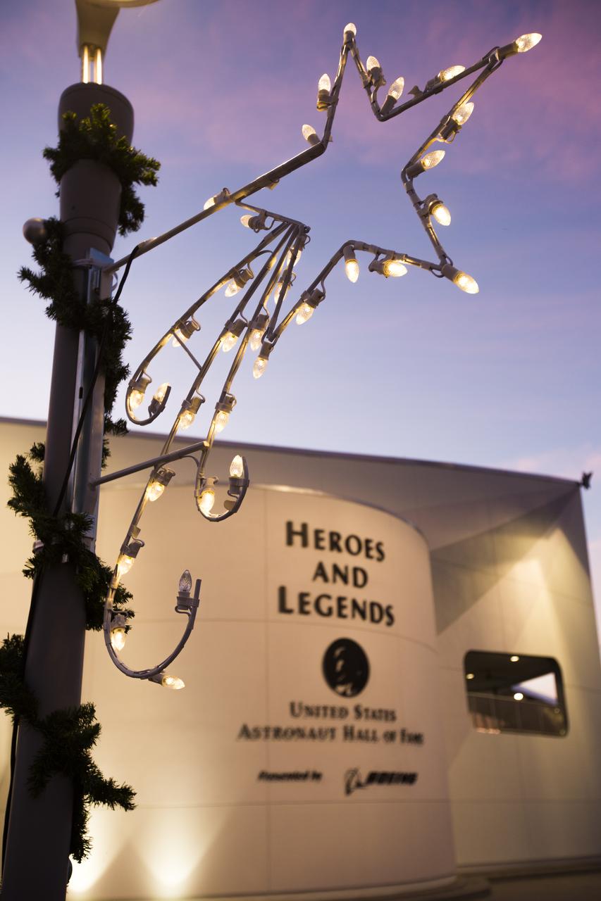 The exterior of the Heroes and Legends exhibit at the Kennedy Space Center Visitor Complex in Florida is festively decorated for Holidays in Space 2017.  The event kicked off Dec. 20 with a dazzling performance by the dance group Fighting Gravity, followed by a fireworks finale. Holidays in Space 2017 includes nightly performances from Dec. 20 through 31, excluding Dec. 25. 
