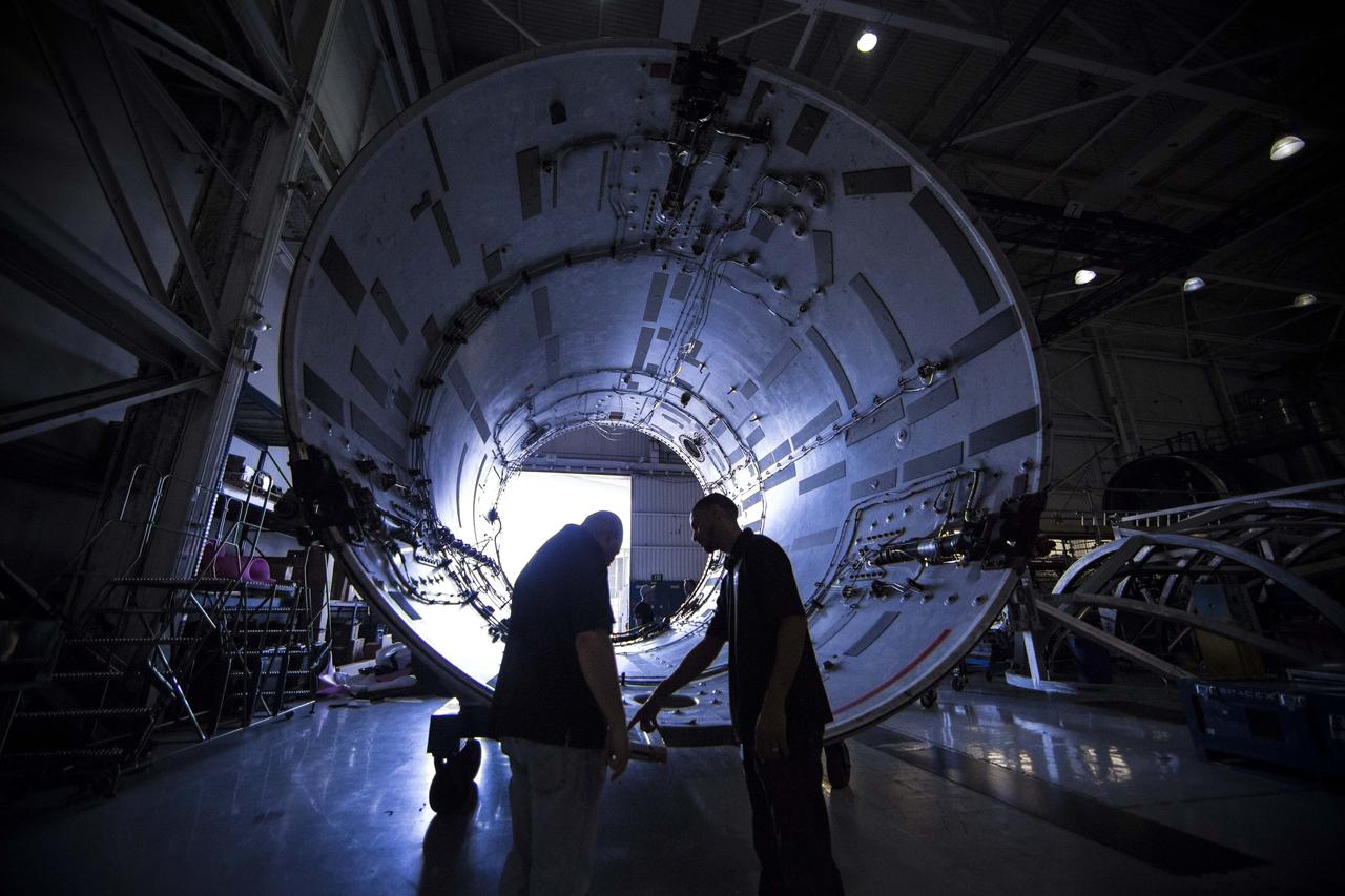 The inter-stage of a SpaceX Falcon 9 rocket inside the company's manufacturing facility. SpaceX is developing its Crew Dragon spacecraft and Falcon 9 rocket in partnership with NASA's Commercial Crew Program to carry astronauts to and from the International Space Station.