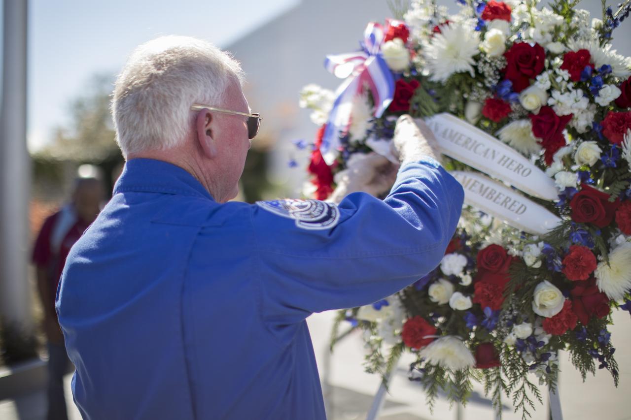 Former NASA astronaut Jon McBride places a wreath at the Heroes and Legends exhibit at the Kennedy Space Center Visitor Complex. The brief memorial honoring NASA astronaut John Young took place on the afternoon of Jan. 11, 2018. Young died Jan. 5, 2018, in Houston at the age of 87. He was the only astronaut to fly in NASA's Gemini, Apollo and Space Shuttle Programs.
