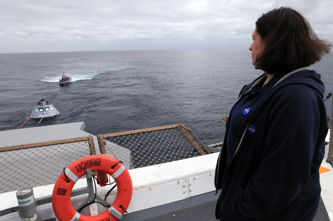 NASA Recovery Director Melissa Jones watches part of Underway Recovery Test 6, from the flight deck of the USS Anchorage. During this portion, the Orion test article is intentionally subjected to an increased sea state as the NASA Recovery Team works hard to keep control of the spacecraft. The testing with Kennedy Space Center's NASA Recovery Team and the U.S. Navy will provide important data that is being used to improve recovery procedures and hardware ahead of Orion's next flight, Exploration Mission-1, when it splashes down in the Pacific Ocean.