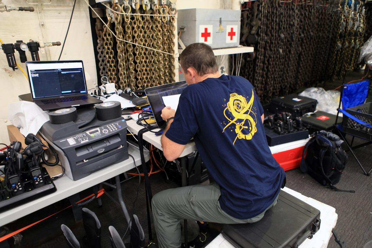 Jamie Peer, part of Kennedy Space Center’s NASA Recovery Team analyzes data from the previous day’s testing as part of Underway Recovery Test 6. The testing with the NASA Recovery Team and the U.S. Navy will provide important data that is being used to improve recovery procedures and hardware ahead of Orion's next flight, Exploration Mission-1, when it splashes down in the Pacific Ocean.