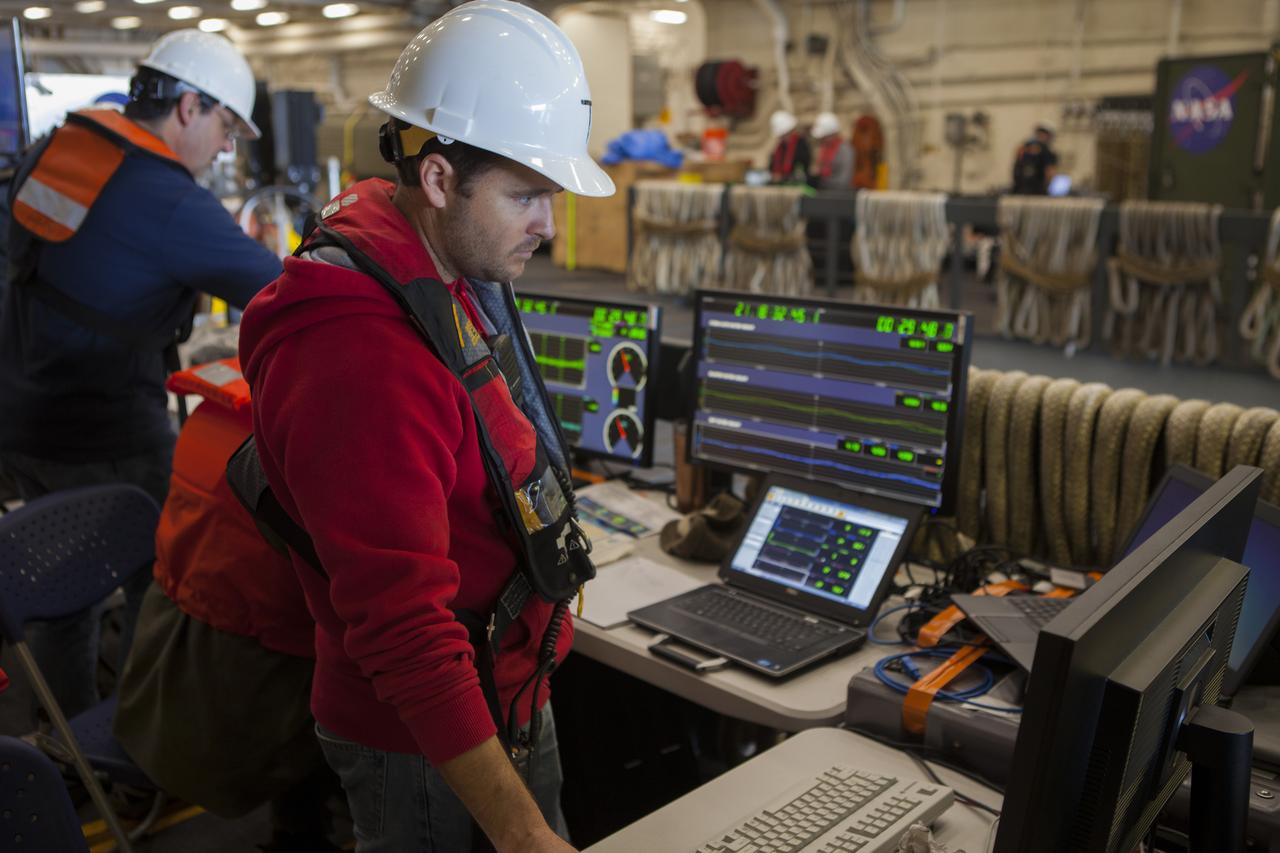 Lead Instrumentation Engineer Kevin Taylor keeps an eye on the load levels during Underway Recovery Test 6 operations off the coast of San Diego. Kennedy Space Center’s NASA Recovery Team works with the U.S. Navy to improve recovery procedures and hardware ahead of Orion's next flight, Exploration Mission-1, when it splashes down in the Pacific Ocean.