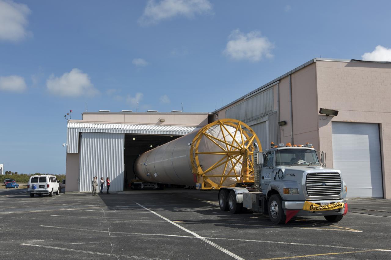 The United Launch Alliance Atlas V booster for NOAA's Geostationary Operational Environmental Satellite-S (GOES-S) arrives at the Atlas Spaceflight Operations Center near Space Launch Complex 41 at Cape Canaveral Air Force Station in Florida. GOES-S is the second in a series of four advanced geostationary weather satellites. The satellite is slated to launch aboard the Atlas V rocket March 1.