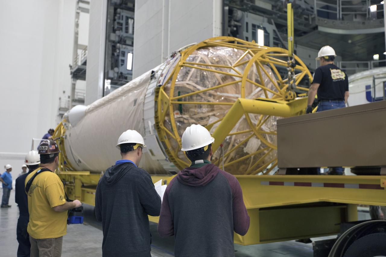 Under the watchful eyes of technicians and engineers, the Centaur upper stage that will help launch NOAA's Geostationary Operational Environmental Satellite-S, or GOES-S, arrives inside the Delta Operations Center at Cape Canaveral Air Force Station for further processing. GOES-S is the second in a series of four advanced geostationary weather satellites. The GOES-R series - consisting of the GOES-R, GOES-S, GOES-T and GOES-U spacecraft - will significantly improve the detection and observation of environmental phenomena that directly affect public safety, protection of property and the nation's economic health and prosperity. GOES-S is slated to launch March 1, 2018 aboard a United Launch Alliance Atlas V rocket.