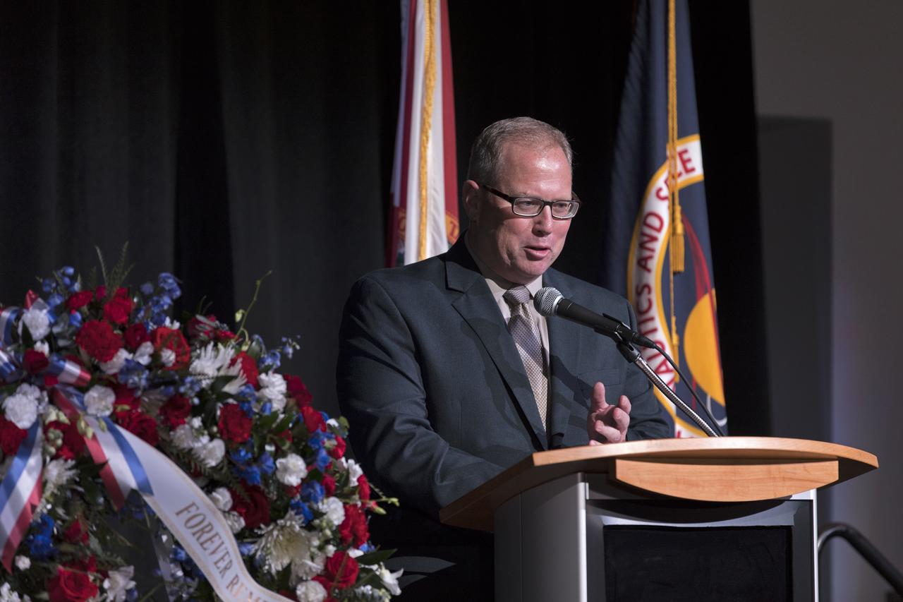 Therrin Protze, chief operating officer of Delaware North, speaks during this year's Day of Remembrance ceremony at the Kennedy Space Center Visitor Complex. Each year spaceport employees and guests join others throughout NASA honoring the contributions of astronauts who have perished in the conquest of space.