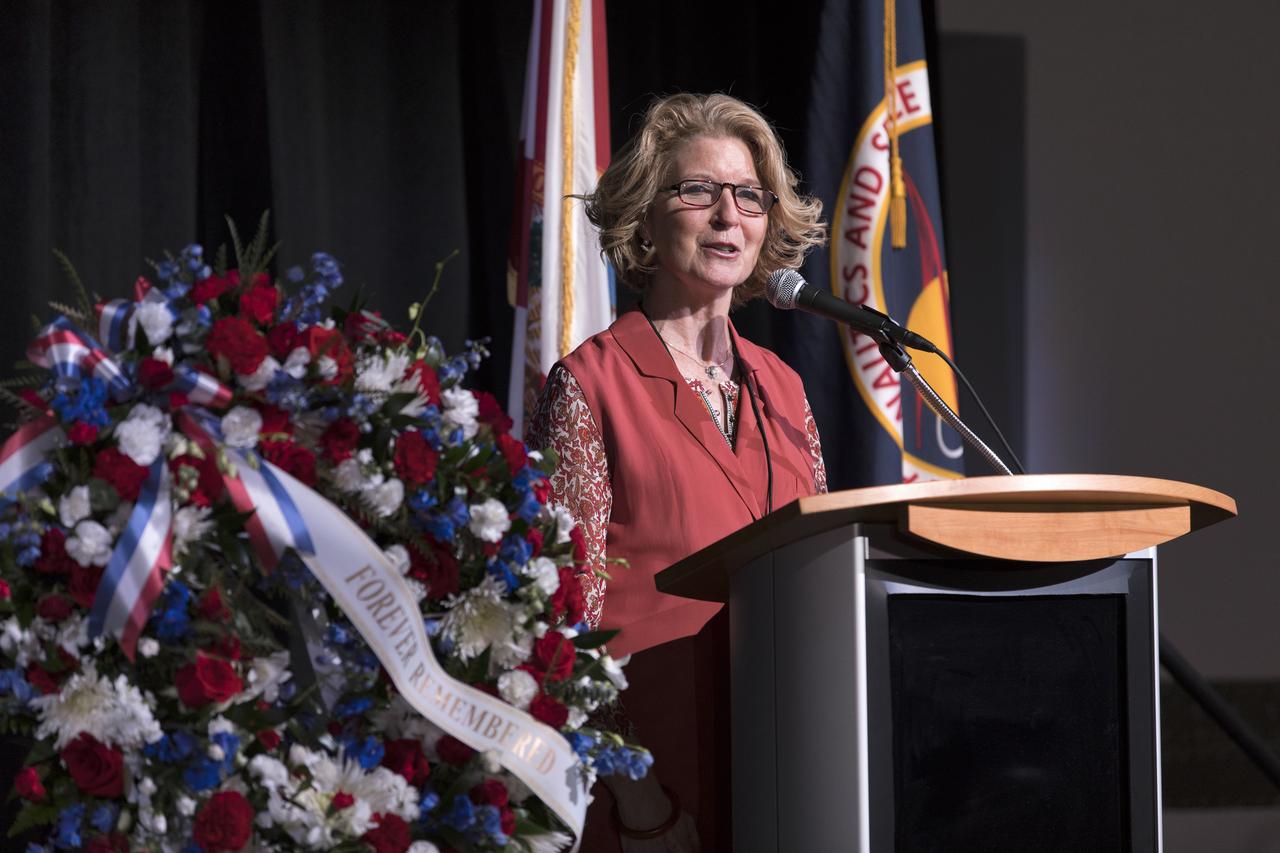 Sally Kneuven, daughter of NASA astronaut Elliot See, speaks during this year's Day of Remembrance ceremony at the Kennedy Space Center Visitor Complex. Each year spaceport employees and guests join others throughout NASA honoring the contributions of astronauts who have perished in the conquest of space.