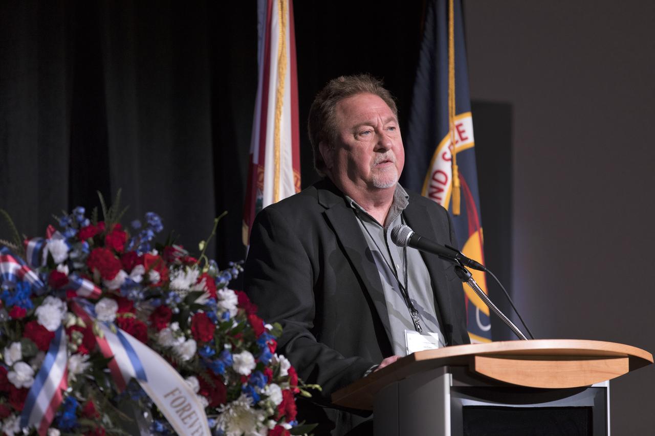 Brent Adams, son of U.S. Air Force astronaut Mike Adams, speaks during this year's Day of Remembrance ceremony at the Kennedy Space Center Visitor Complex. Each year spaceport employees and guests join others throughout NASA honoring the contributions of astronauts who have perished in the conquest of space.