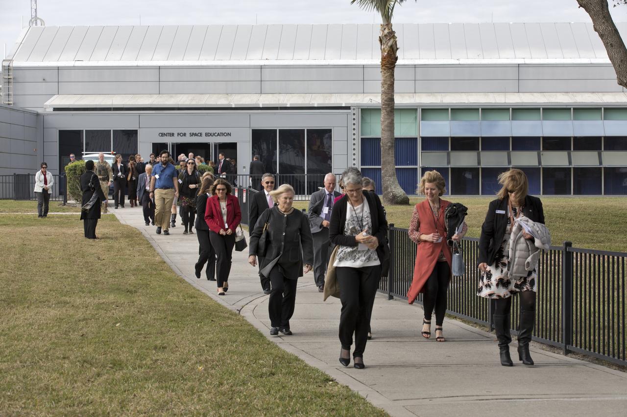 Following this year's Day of Remembrance ceremony at the Kennedy Space Center Visitor Complex, guests walk to the Space Mirror Memorial. The names of fallen astronauts from Apollo 1, Challenger and Columbia, as well as the astronauts who perished in training and commercial airplane accidents are emblazoned on the monument. Each year spaceport employees and guests join others throughout NASA honoring the contributions of astronauts who have perished in the conquest of space.