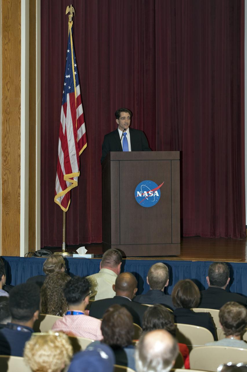 Mike Ciannilli, the Apollo, Challenger, Columbia Lessons Learned Program manager, welcomes employees to a lessons learned presentation in the Training Auditorium at NASA’s Kennedy Space Center in Florida. The program's theme was "Columbia: Lessons and Legends of Recovery." The event featured a panel discussion moderated by Kennedy Center Director Bob Cabana.