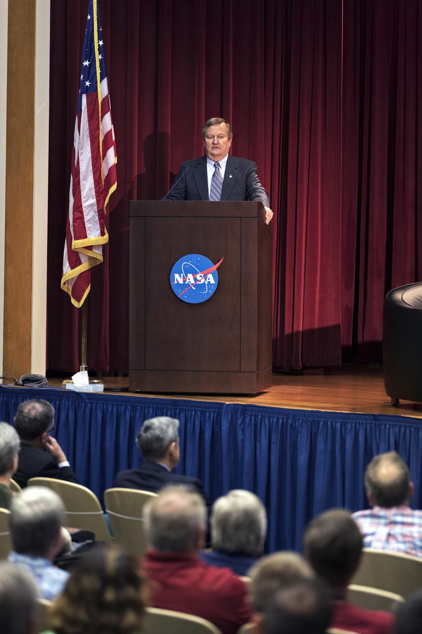 Former NASA Shuttle Launch Director Mike Leinbach speaks to employees during an Apollo, Challenger, Columbia Lessons Learned Program event in the Training Auditorium at Kennedy Space Center in Florida. The program's theme was "Columbia: Lessons and Legends of Recovery." Leinbach participated in a panel discussion during the event. 