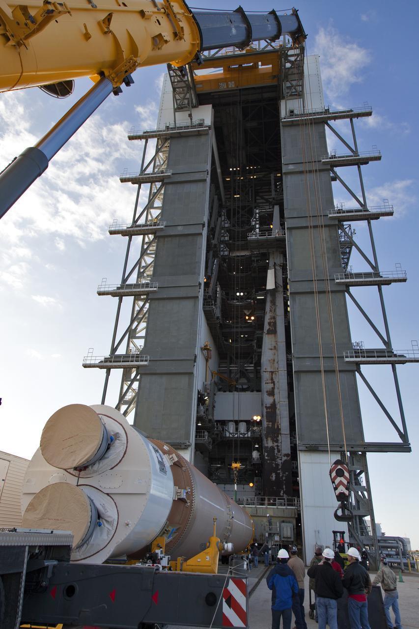 A crane lifts a United Launch Alliance Atlas V first stage at the Vertical Integration Facility at Space Launch Complex 41 at Cape Canaveral Air Force Station in Florida. The rocket will be positioned on its launcher to boost the Geostationary Operational Environmental Satellite, or GOES-S. It will be the second in a series of four advanced geostationary weather satellites and will significantly improve the detection and observation of environmental phenomena that directly affect public safety. GOES-S is slated to launch March 1, 2018.