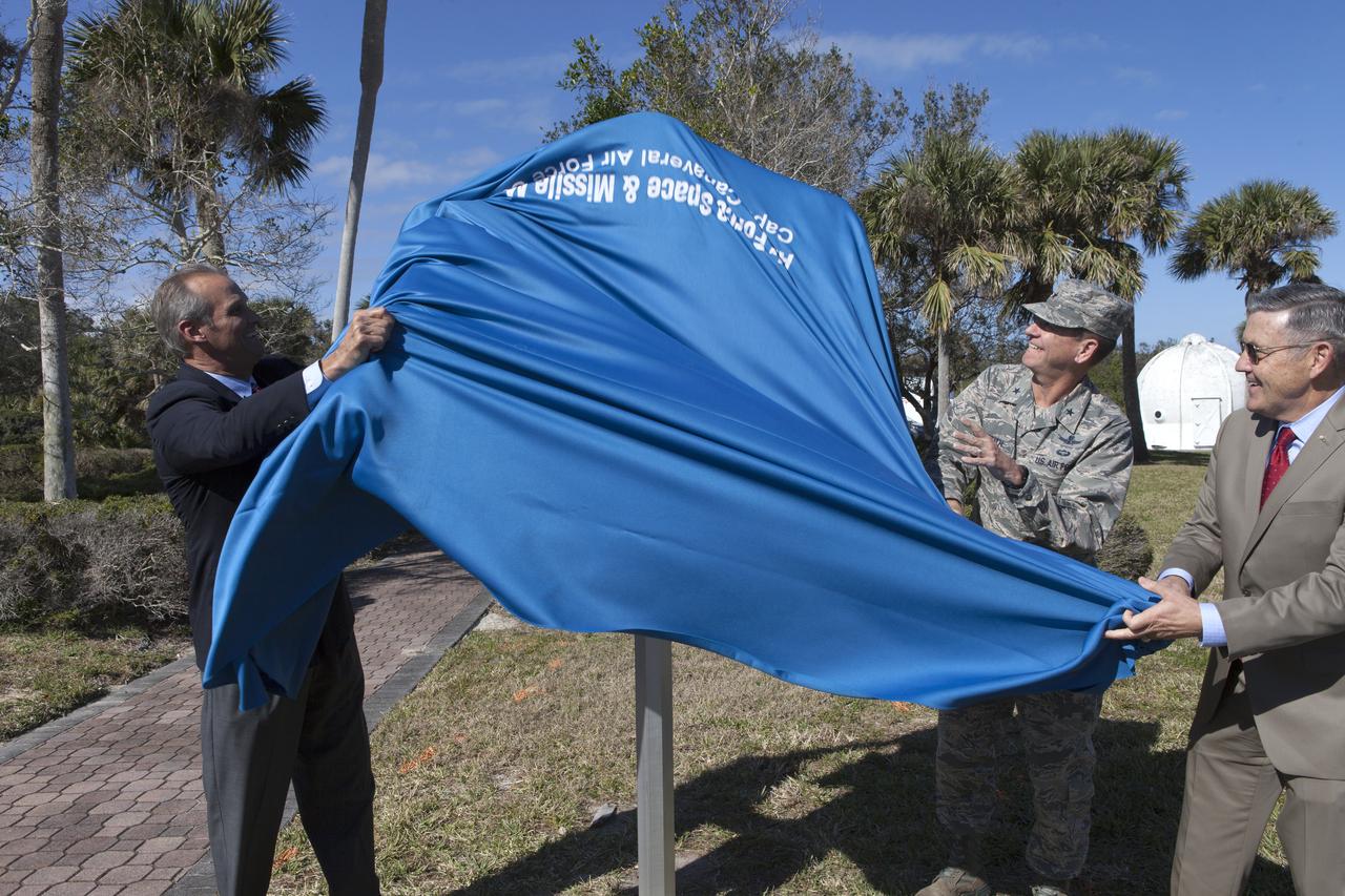 During a ceremony at Cape Canaveral Air Force Station's Space Launch Complex 26 a historical marker is unveiled noting the launch of America's first satellite, Explorer 1. From the left, Ray Sands, chairman of the Air Force Space and Missile Foundation -- sponsor of the marker, Brig. Gen. Wayne Monteith, 45th Space Wing commander and director of the Eastern Range and Kennedy Space Center Director Bob Cabana. The Explorer 1 satellite was launched atop a Jupiter C rocket on Jan. 31, 1958. During operation, the satellite's cosmic ray detector discovered radiation belts around Earth which were named for Dr. James Van Allen, principal investigator for the satellite.