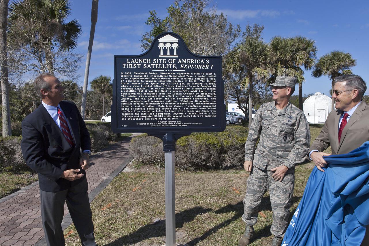 During a ceremony at Cape Canaveral Air Force Station's Space Launch Complex 26 a historical marker is unveiled noting the launch of America's first satellite, Explorer 1. From the left, Ray Sands, chairman of the Air Force Space and Missile Foundation -- sponsor of the marker, Brig. Gen. Wayne Monteith, 45th Space Wing commander and director of the Eastern Range and Kennedy Space Center Director Bob Cabana. The Explorer 1 satellite was launched atop a Jupiter C rocket on Jan. 31, 1958. During operation, the satellite's cosmic ray detector discovered radiation belts around Earth which were named for Dr. James Van Allen, principal investigator for the satellite.