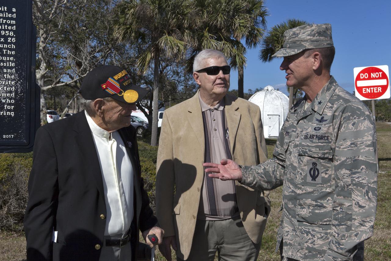 Brig. Gen. Wayne Monteith, 45th Space Wing commander and director of the Eastern Range, right, speaks with Launch team members who supported the launch of America's first satellite, Explorer 1. They spoke following an event celebrating the 60th anniversary of America's first satellite. The ceremony took place in front of the Space Launch Complex 26 blockhouse at Cape Canaveral Air Force Station where the Explorer 1 satellite was launched atop a Jupiter C rocket on Jan. 31, 1958. During operation, the satellite's cosmic ray detector discovered radiation belts around Earth which were named for Dr. James Van Allen, principal investigator for the satellite.