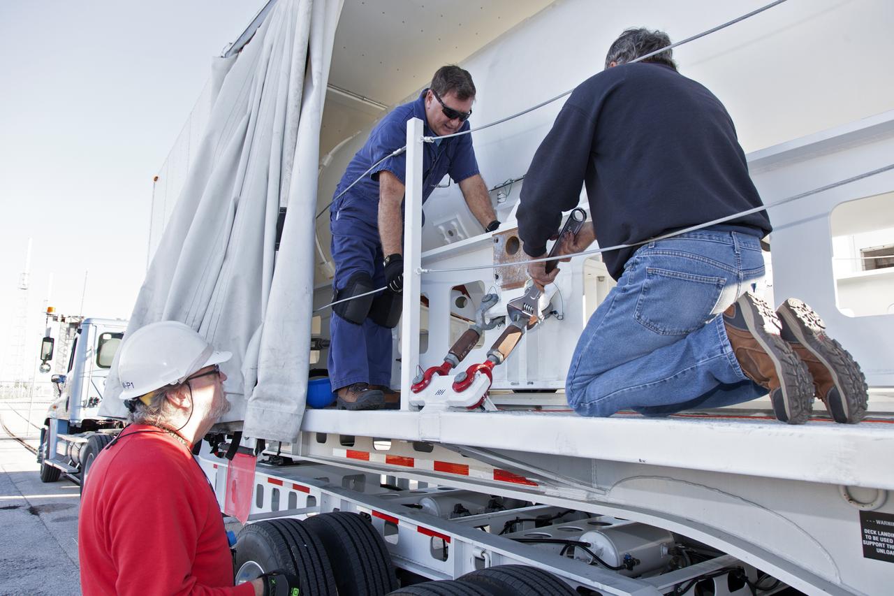 Technicians prepare to offload a solid rocket booster (SRB) that just arrived at the Vertical Integration Facility at Space Launch Complex 41 at Cape Canaveral Air Force Station in Florida. The SRB will be mated to a United Launch Alliance Atlas V first stage to help boost NOAA's Geostationary Operational Environmental Satellite, or GOES-S, to orbit. GOES-S is the second in a series of four advanced geostationary weather satellites that will significantly improve the detection and observation of environmental phenomena that directly affect public safety, protection of property and the nation's economic health and prosperity. GOES-S is slated to launch March 1, 2018.