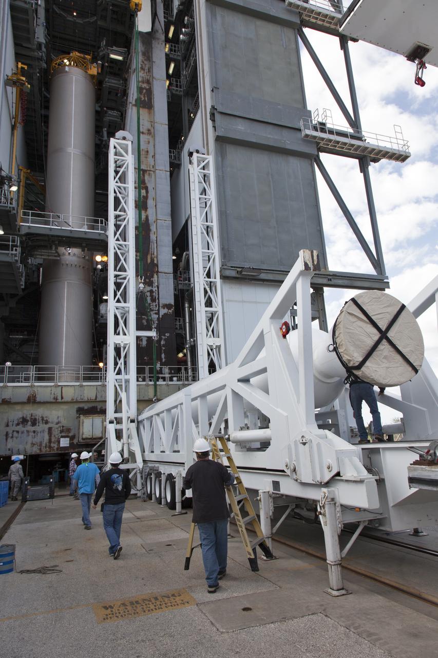 Technicians and engineers offload a solid rocket booster (SRB) that just arrived at the Vertical Integration Facility at Space Launch Complex 41 at Cape Canaveral Air Force Station in Florida. The SRB will be mated to a United Launch Alliance Atlas V first stage to help boost NOAA's Geostationary Operational Environmental Satellite, or GOES-S, to orbit. GOES-S is the second in a series of four advanced geostationary weather satellites that will significantly improve the detection and observation of environmental phenomena that directly affect public safety, protection of property and the nation's economic health and prosperity. GOES-S is slated to launch March 1, 2018.