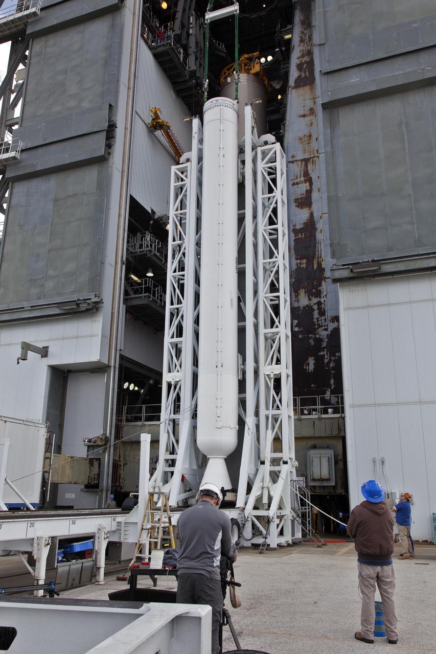 A solid rocket booster (SRB) is lifted for mating to a United Launch Alliance Atlas V first stage in the Vertical Integration Facility at Space Launch Complex 41 at Cape Canaveral Air Force Station in Florida. The SRB will be help boost NOAA's Geostationary Operational Environmental Satellite, or GOES-S, to orbit. GOES-S is the second in a series of four advanced geostationary weather satellites that will significantly improve the detection and observation of environmental phenomena that directly affect public safety, protection of property and the nation's economic health and prosperity. GOES-S is slated to launch March 1, 2018.