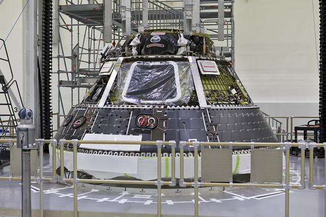Heat shield back shell panels are prefitted on the Orion spacecraft inside the Neil Armstrong Operations and Checkout Building high bay at NASA's Kennedy Space Center in Florida. The back shell panels serve as the outer layer of the spacecraft and will protect it against the extreme temperatures of re-entry from deep space. Orion is being prepared for its first integrated uncrewed flight atop NASA's Space Launch System rocket on Exploration Mission-1 from Launch Pad 39B at Kennedy Space Center.