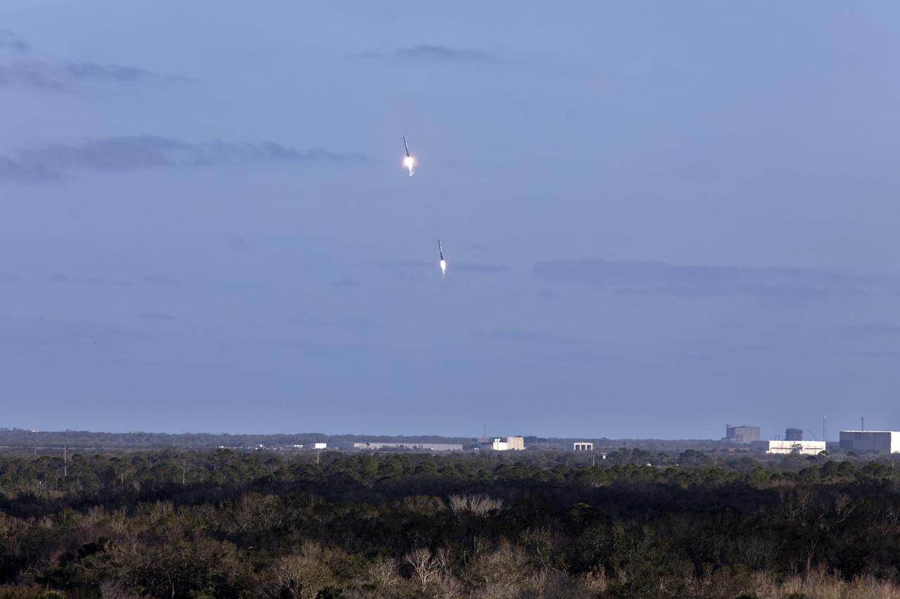 The SpaceX Falcon Heavy rocket’s two side cores descend toward landing at Cape Canaveral Air Force Station in Florida following a successful liftoff at 3:45 p.m. EST from Launch Complex 39A at NASA's Kennedy Space Center. This demonstration flight is a significant milestone for the world's premier multi-user spaceport. In 2014, NASA signed a property agreement with SpaceX for the use and operation of the center's pad 39A, where the company has launched Falcon 9 rockets and prepared for the first Falcon Heavy. NASA also has Space Act Agreements in place with partners, such as SpaceX, to provide services needed to process and launch rockets and spacecraft.