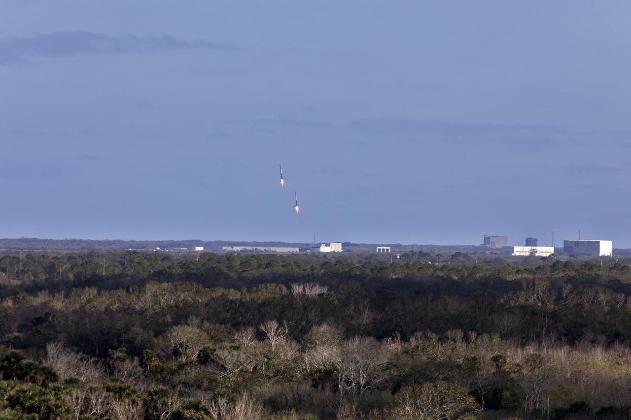The SpaceX Falcon Heavy rocket’s two side cores descend toward landing at Cape Canaveral Air Force Station in Florida following a successful liftoff at 3:45 p.m. EST from Launch Complex 39A at NASA's Kennedy Space Center. This demonstration flight is a significant milestone for the world's premier multi-user spaceport. In 2014, NASA signed a property agreement with SpaceX for the use and operation of the center's pad 39A, where the company has launched Falcon 9 rockets and prepared for the first Falcon Heavy. NASA also has Space Act Agreements in place with partners, such as SpaceX, to provide services needed to process and launch rockets and spacecraft.