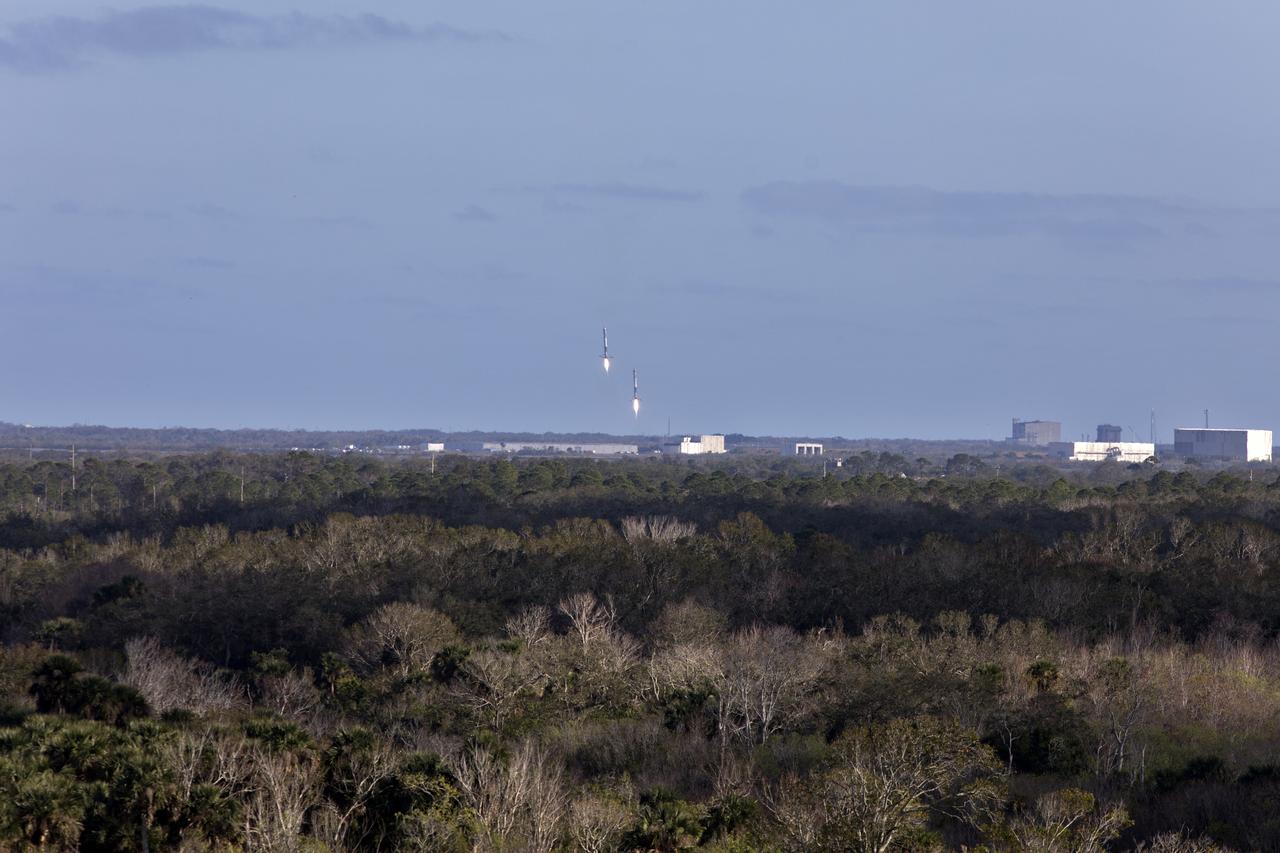 The SpaceX Falcon Heavy rocket’s two side cores descend toward landing at Cape Canaveral Air Force Station in Florida following a successful liftoff at 3:45 p.m. EST from Launch Complex 39A at NASA's Kennedy Space Center. This demonstration flight is a significant milestone for the world's premier multi-user spaceport. In 2014, NASA signed a property agreement with SpaceX for the use and operation of the center's pad 39A, where the company has launched Falcon 9 rockets and prepared for the first Falcon Heavy. NASA also has Space Act Agreements in place with partners, such as SpaceX, to provide services needed to process and launch rockets and spacecraft.