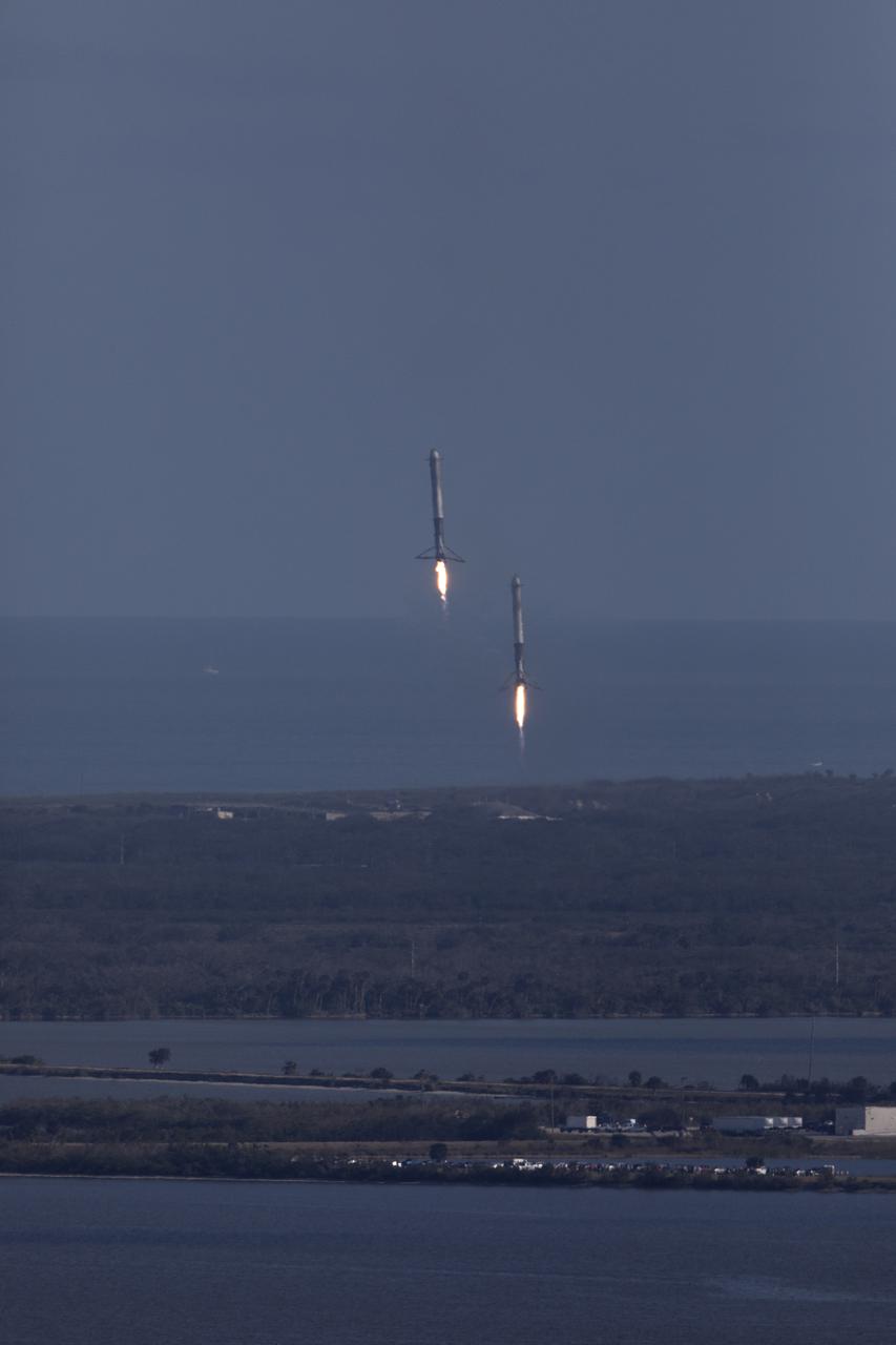 The SpaceX Falcon Heavy rocket’s two side cores descend toward landing at Cape Canaveral Air Force Station in Florida following a successful liftoff at 3:45 p.m. EST from Launch Complex 39A at NASA's Kennedy Space Center. This demonstration flight is a significant milestone for the world's premier multi-user spaceport. In 2014, NASA signed a property agreement with SpaceX for the use and operation of the center's pad 39A, where the company has launched Falcon 9 rockets and prepared for the first Falcon Heavy. NASA also has Space Act Agreements in place with partners, such as SpaceX, to provide services needed to process and launch rockets and spacecraft.