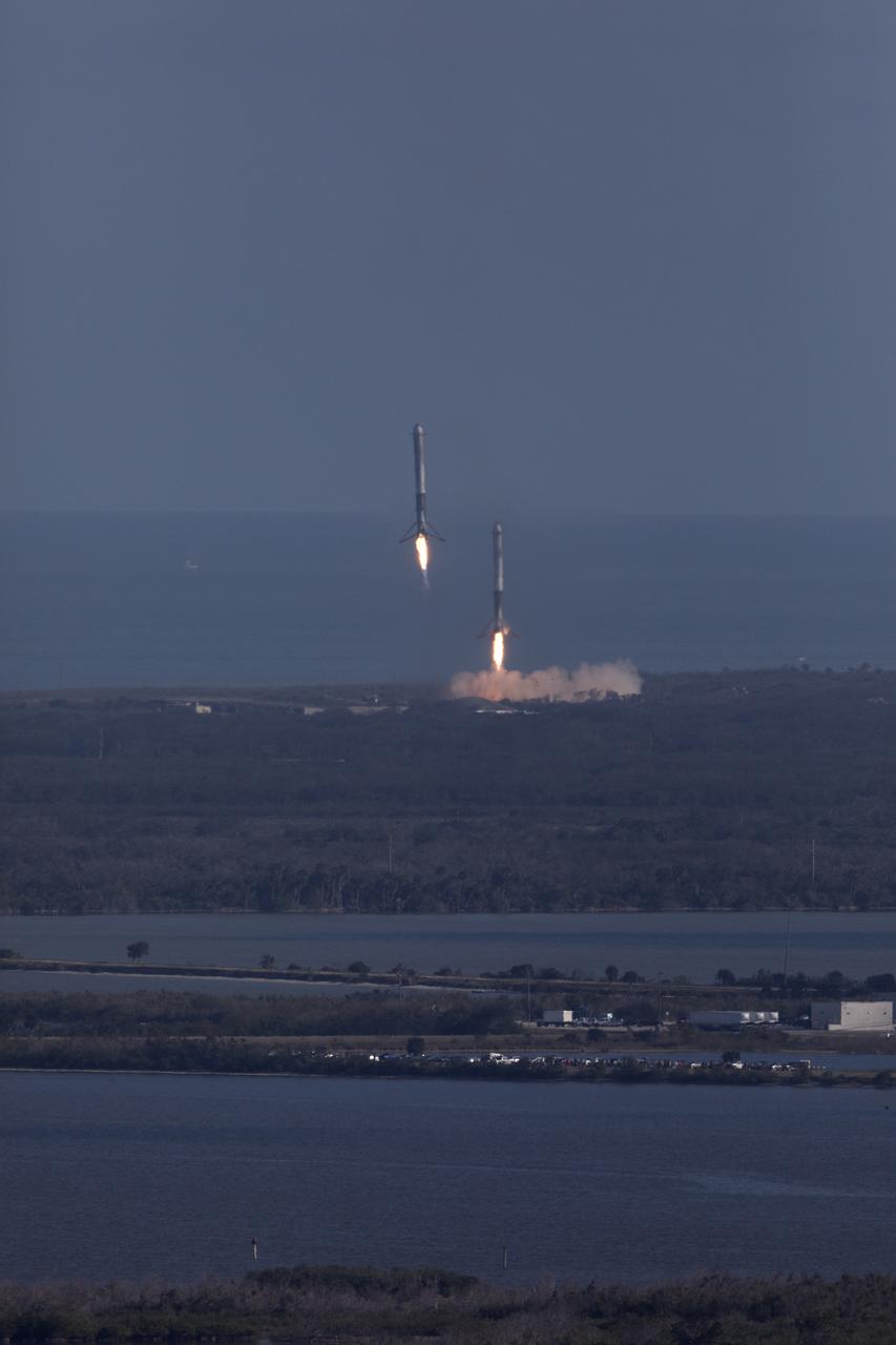 The SpaceX Falcon Heavy rocket’s two side cores descend toward landing at Cape Canaveral Air Force Station in Florida following a successful liftoff at 3:45 p.m. EST from Launch Complex 39A at NASA's Kennedy Space Center. This demonstration flight is a significant milestone for the world's premier multi-user spaceport. In 2014, NASA signed a property agreement with SpaceX for the use and operation of the center's pad 39A, where the company has launched Falcon 9 rockets and prepared for the first Falcon Heavy. NASA also has Space Act Agreements in place with partners, such as SpaceX, to provide services needed to process and launch rockets and spacecraft.