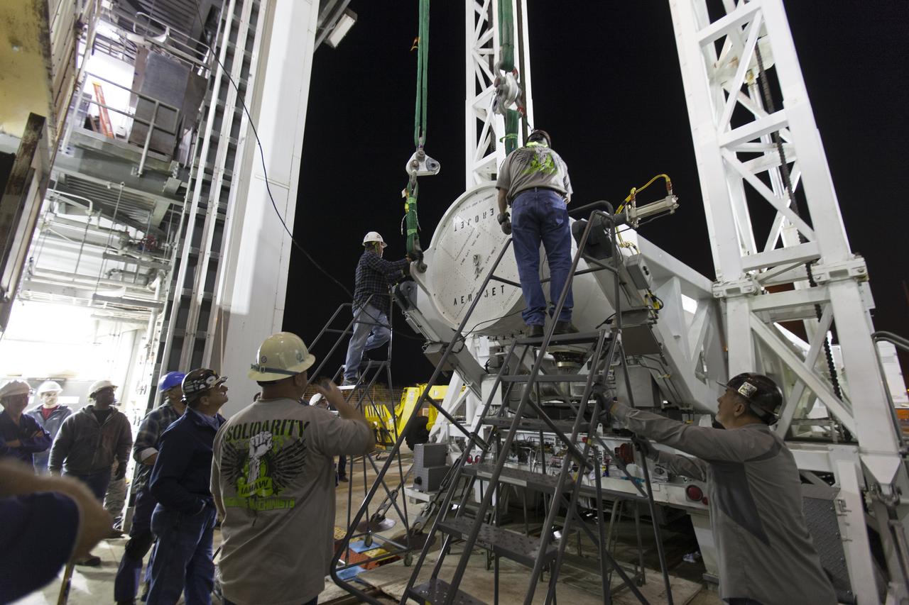 Technicians and engineers prepare to mate a solid rocket booster (SRB) to a United Launch Alliance Atlas V first stage in the Vertical Integration Facility at Space Launch Complex 41 at Cape Canaveral Air Force Station in Florida. The SRB will help boost NOAA's Geostationary Operational Environmental Satellite, or GOES-S, to orbit. GOES-S is the second in a series of four advanced geostationary weather satellites that will significantly improve the detection and observation of environmental phenomena that directly affect public safety, protection of property and the nation's economic health and prosperity. GOES-S is slated to launch March 1, 2018.